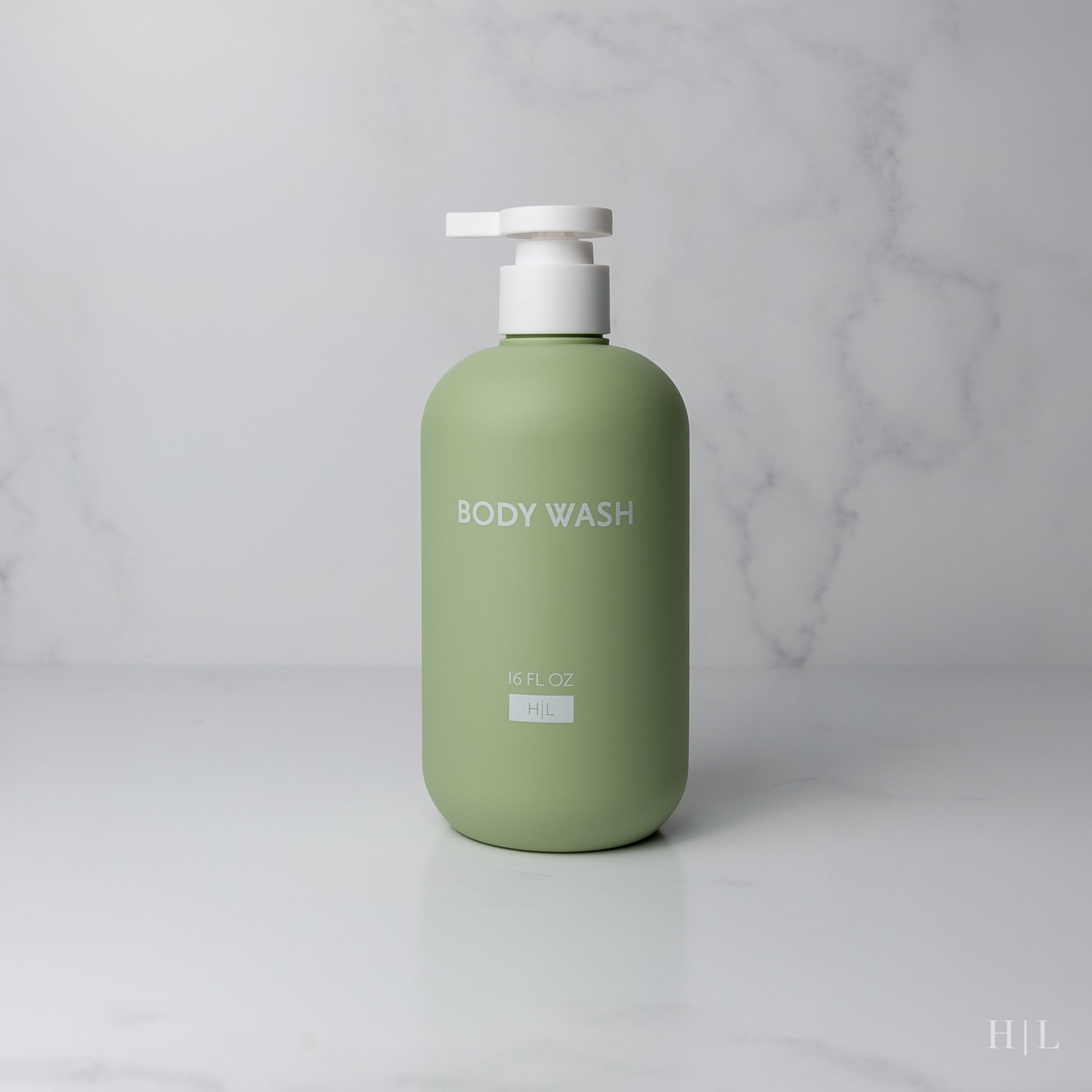 a bottle of body wash sitting on a counter